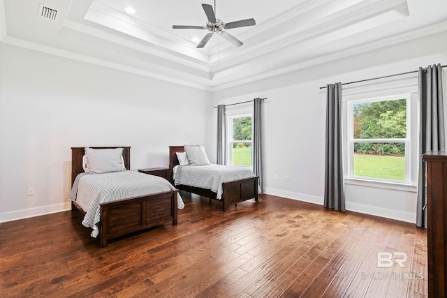 360 Nandina Loop, Fairhope, AL 36532 - bedroom featuring a tray ceiling, hardwood / wood-style flooring, crown molding, baseboards, and ceiling fan
