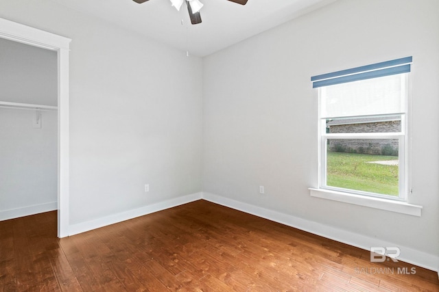 360 Nandina Loop, Fairhope, AL 36532 - unfurnished bedroom with wood finished floors, baseboards, a closet, and a ceiling fan