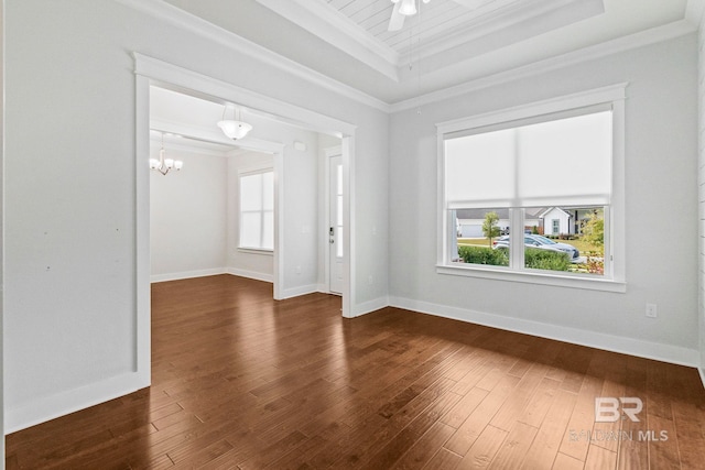 interior space with crown molding, a raised ceiling, dark hardwood / wood-style flooring, and a notable chandelier