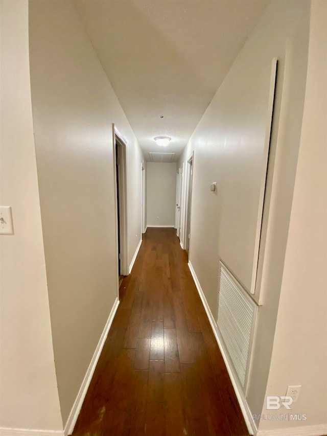 hall with dark hardwood / wood-style floors