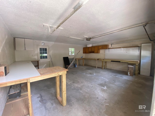 basement featuring a textured ceiling