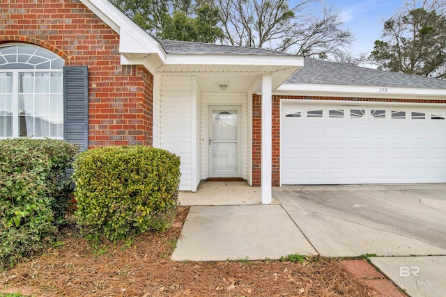 entrance to property featuring a garage