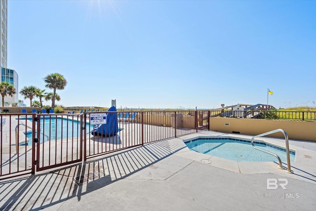 community pool featuring fence