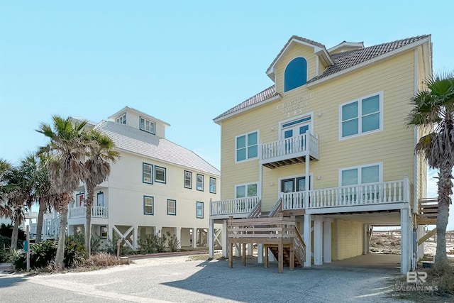 exterior space with a carport and stairway