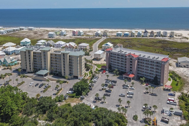 bird's eye view featuring a view of the beach and a water view