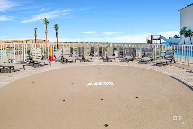 exterior space featuring a community pool and a patio area