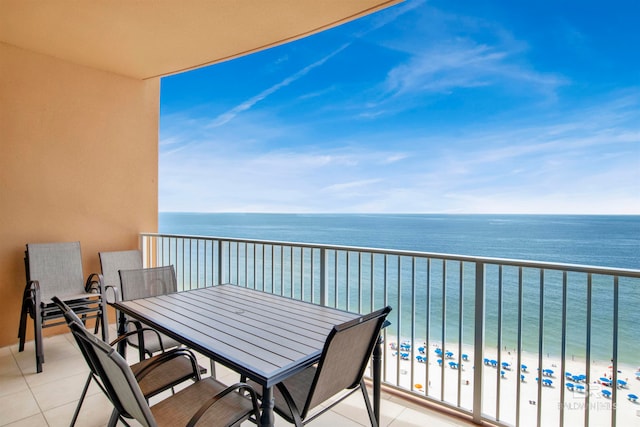 balcony featuring a beach view and a water view