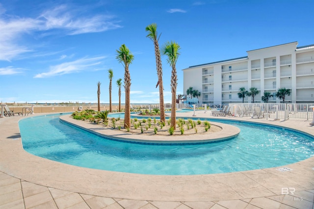 view of swimming pool featuring a patio