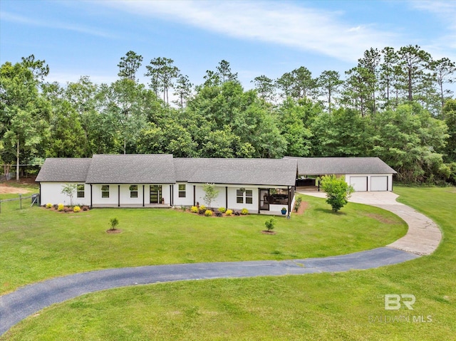 single story home featuring a front yard, fence, and driveway