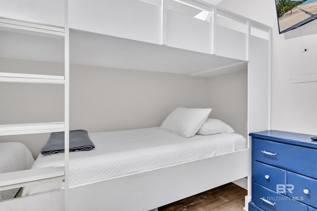 bedroom with dark wood-type flooring