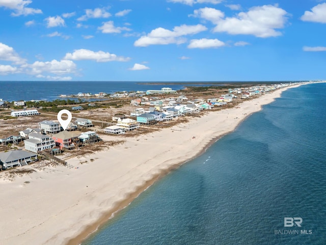 drone / aerial view featuring a view of the beach and a water view