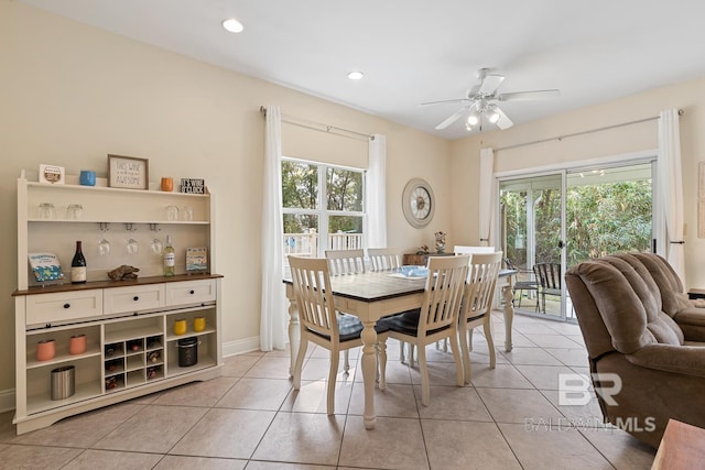 4615 Nancy Ln Unit 8, Orange Beach, AL 36561 - dining area featuring ceiling fan, a healthy amount of sunlight, and light tile patterned floors