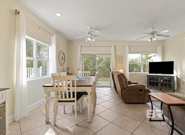 4615 Nancy Ln Unit 8, Orange Beach, AL 36561 - dining area featuring light tile patterned flooring, a healthy amount of sunlight, and ceiling fan