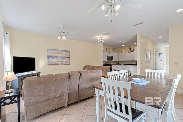 4615 Nancy Ln Unit 8, Orange Beach, AL 36561 - dining room with light tile patterned floors and ceiling fan