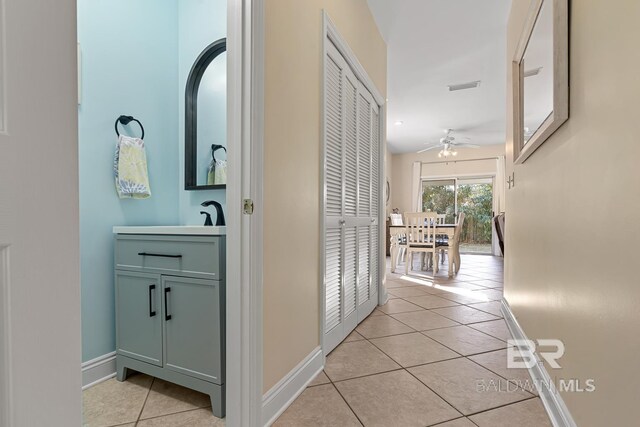 4615 Nancy Ln Unit 8, Orange Beach, AL 36561 - hallway with sink and light tile patterned floors