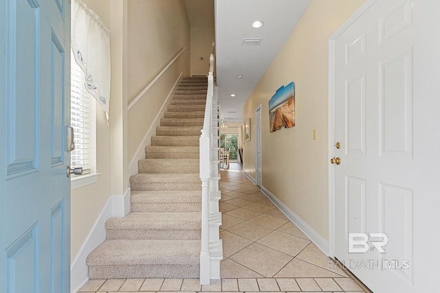 4615 Nancy Ln Unit 8, Orange Beach, AL 36561 - staircase featuring plenty of natural light and tile patterned floors