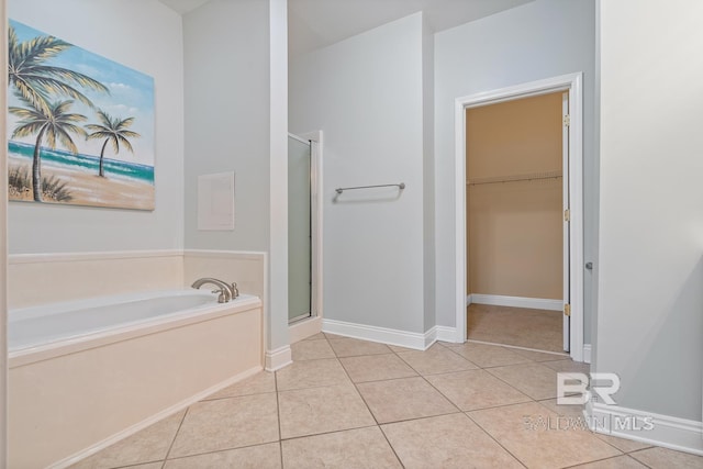 4615 Nancy Ln Unit 8, Orange Beach, AL 36561 - bathroom featuring tile patterned floors and shower with separate bathtub