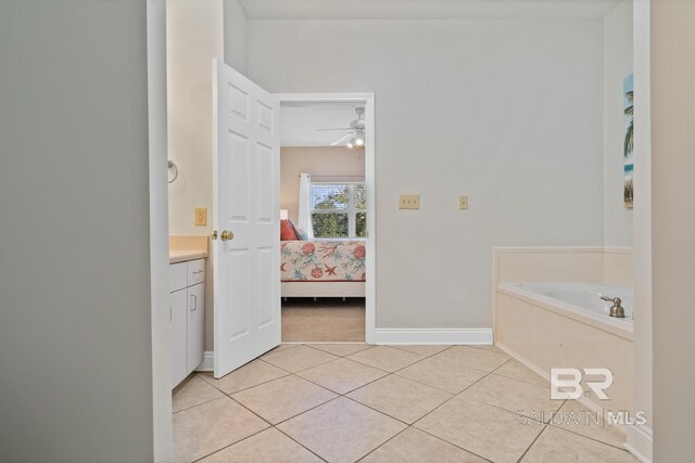 4615 Nancy Ln Unit 8, Orange Beach, AL 36561 - bathroom with tile patterned flooring, ceiling fan, vanity, and a bathtub