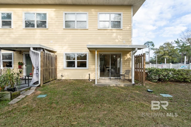 4615 Nancy Ln Unit 8, Orange Beach, AL 36561 - back of house featuring a patio and a yard