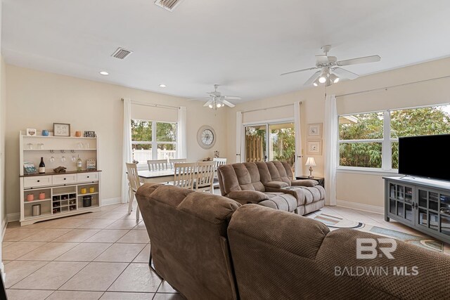 4615 Nancy Ln Unit 8, Orange Beach, AL 36561 - living room with light tile patterned floors, a healthy amount of sunlight, and ceiling fan