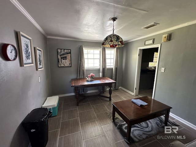 dining space with crown molding