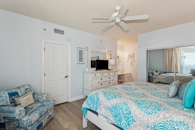 bedroom featuring ceiling fan, a closet, and light hardwood / wood-style flooring