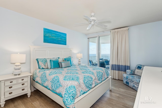 bedroom featuring access to outside, ceiling fan, and light wood-type flooring