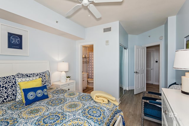 bedroom with connected bathroom, ceiling fan, and hardwood / wood-style floors