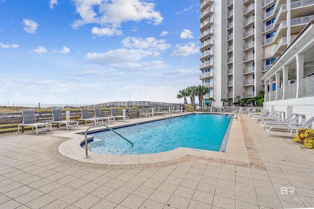 view of swimming pool with a patio