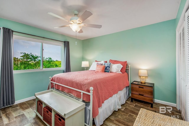 bedroom featuring hardwood / wood-style flooring, a closet, and ceiling fan