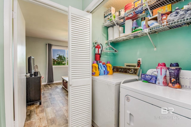 laundry area with independent washer and dryer, washer hookup, and hardwood / wood-style floors