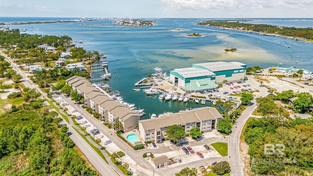 birds eye view of property with a water view