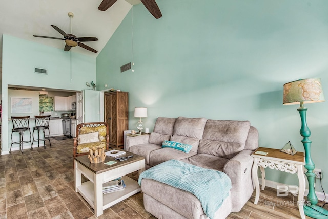 living room with wood-type flooring, high vaulted ceiling, and ceiling fan