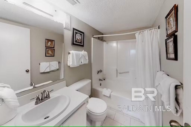 full bathroom featuring shower / bath combination with curtain, vanity, toilet, tile patterned floors, and a textured ceiling