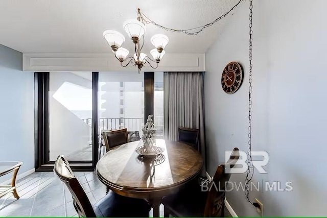 dining space featuring an inviting chandelier