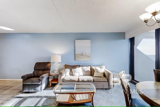 tiled living room featuring a notable chandelier