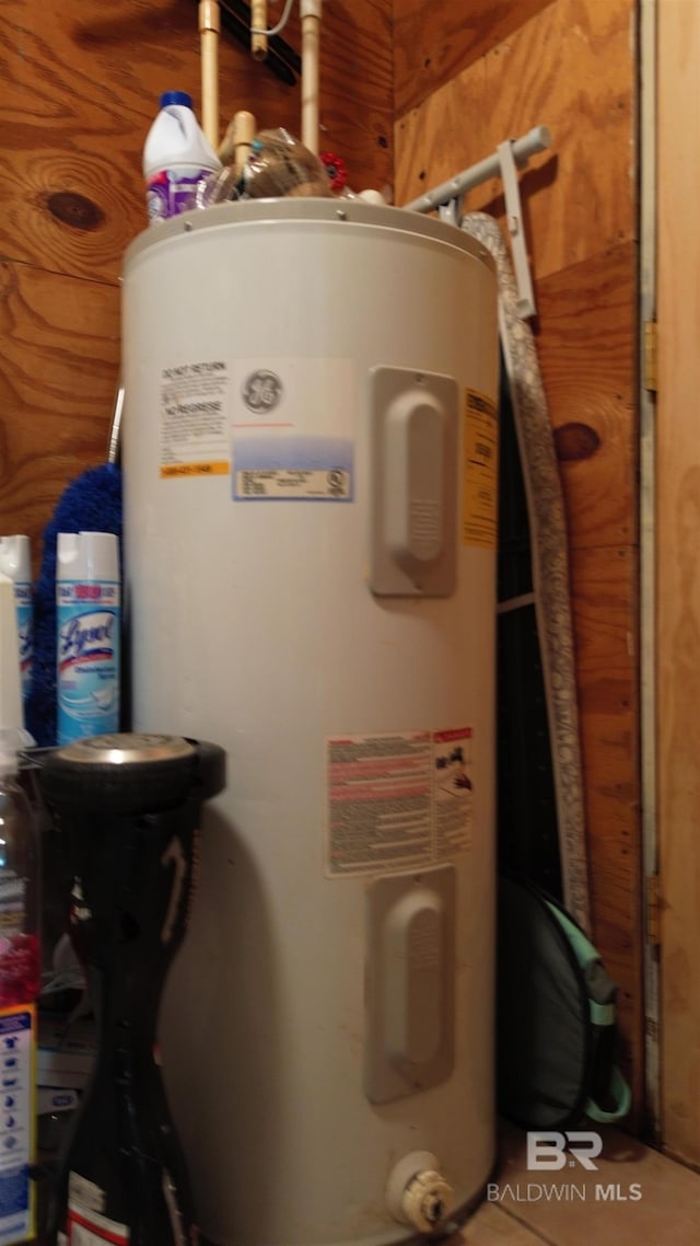 utility room with electric water heater