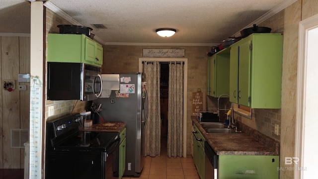 kitchen featuring a textured ceiling, green cabinetry, light tile patterned floors, and electric range oven