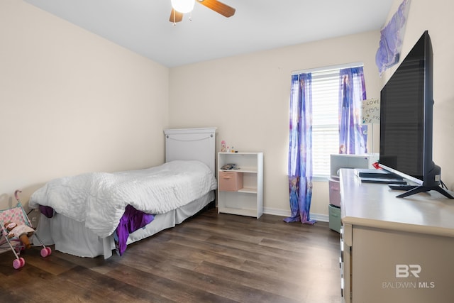 bedroom featuring ceiling fan and dark hardwood / wood-style floors