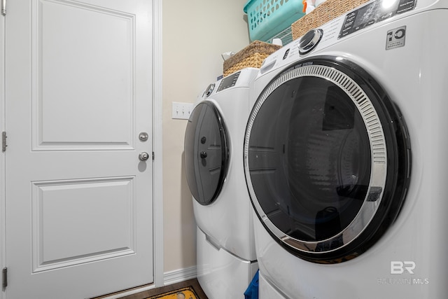 clothes washing area featuring washing machine and dryer