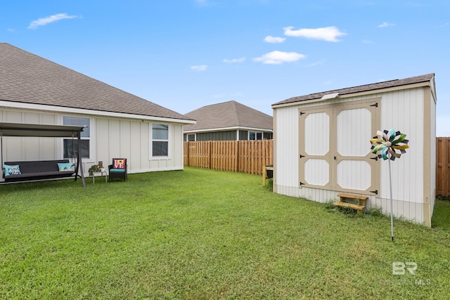 view of yard with a storage unit