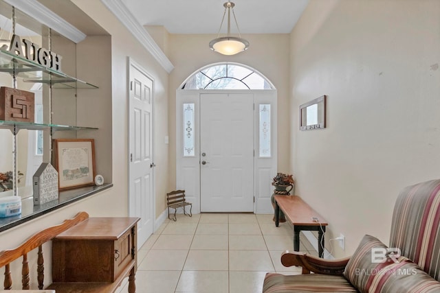 entrance foyer with baseboards and light tile patterned flooring