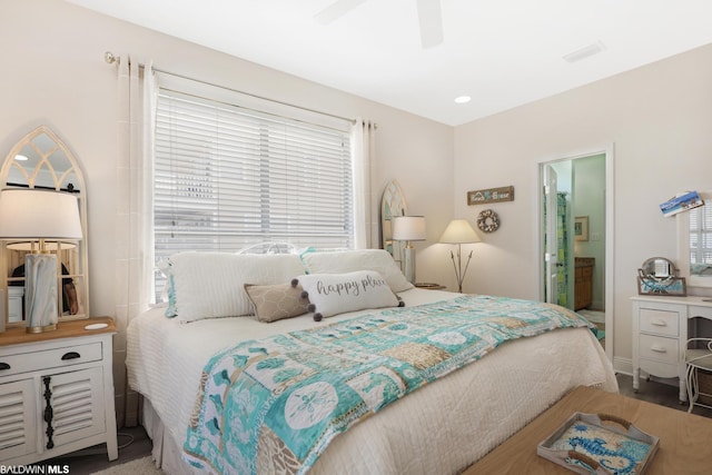 bedroom featuring ceiling fan and connected bathroom
