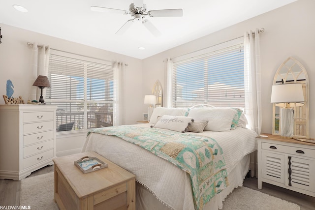 bedroom featuring ceiling fan and light wood-type flooring