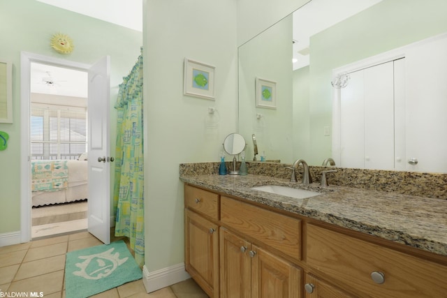 bathroom featuring vanity and tile floors
