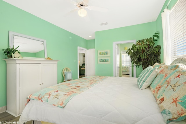 bedroom featuring ceiling fan and hardwood / wood-style flooring
