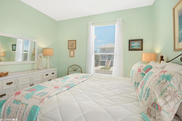 bedroom with multiple windows