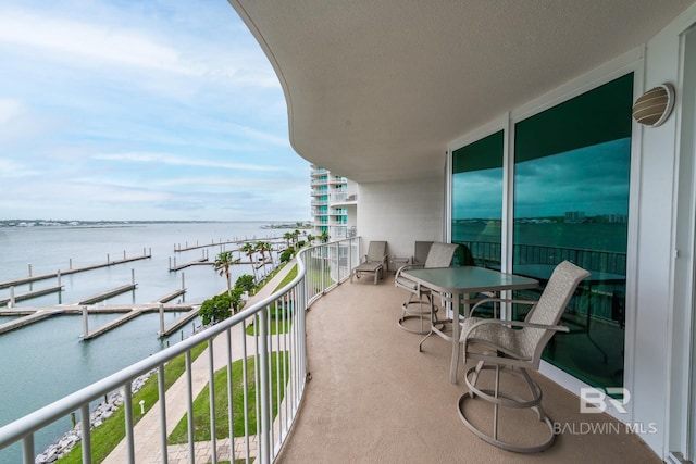 balcony featuring a water view