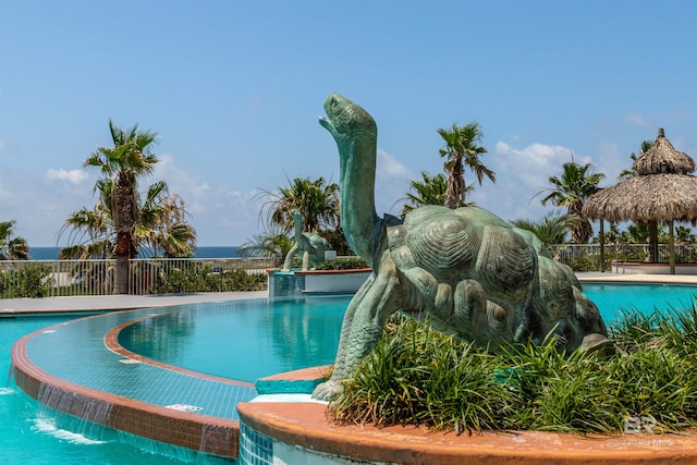 view of swimming pool featuring pool water feature