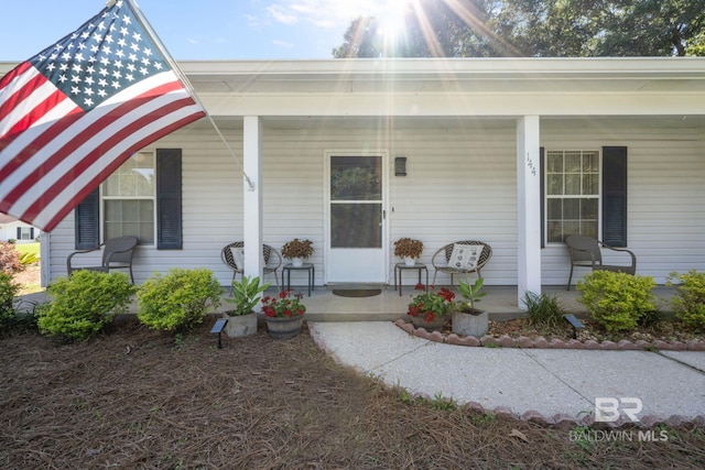 entrance to property featuring covered porch